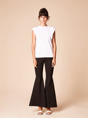 She Is Rebel - Sabiha White Padded Shoulder Organic Cotton T-shirt & Gabrielle Black Extra Flare Wide Leg Pants - Shop Stylish Sustainable Women's Tops