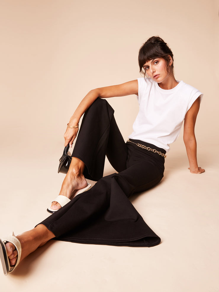 She Is Rebel - Gabrielle Mid Rise Black Extra Wide Flare Pants & Sabiha White Organic Cotton Padded Shoulder T-shirt - Shop Stylish Sustainable Women's Pants
